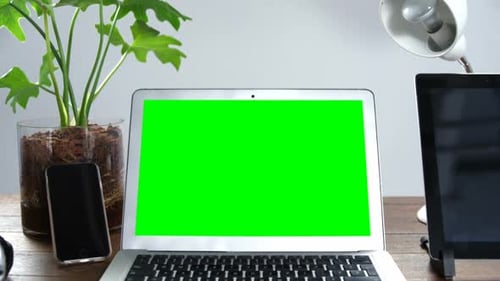 Laptop Green Screen, Tech on Desk