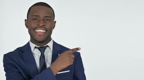 African Businessman Pointing at Product with Finger White Background
