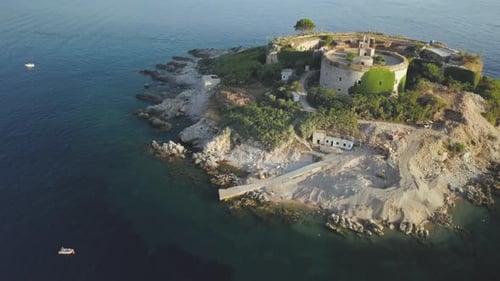 Aerial view of island with an abandoned fortress in the middle of the sea in Montenegro.