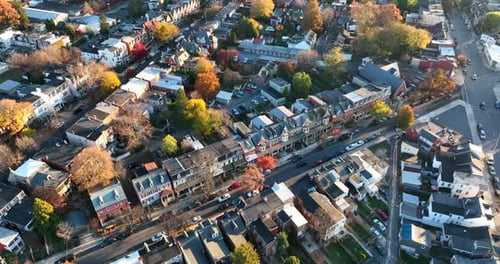 Aerial of downtown suburban city in USA. Beautiful light. Lifestyle in America. Homes and houses wit