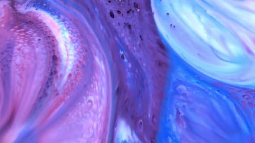 Close Up of Colorful Swirling Paint