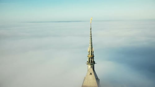 Drone Flying Around Amazing Golden Abbey Spire of Mont Saint Michel Fortress Castle
