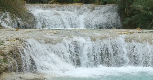 Cascading Waterfall in Lush Tropical Nature