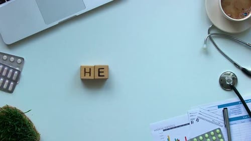 Doctor Spells Out Health With Wooden Blocks