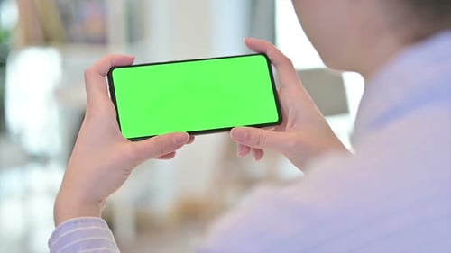 Rear View of Female Viewing Smartphone with Chroma Screen