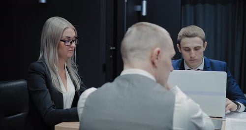 Business Meeting at a Table in an Office