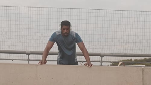 Young Man Running and Exercising Outdoors