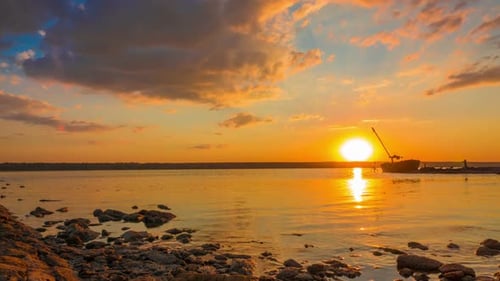 Sunset over the River with Boat in the Background