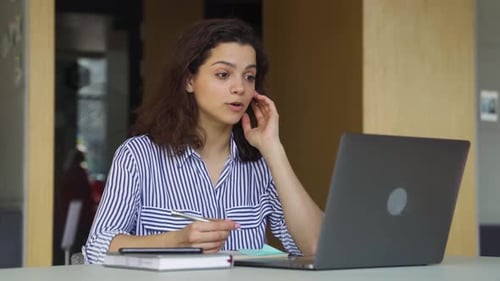 Smiling Young Adult Woman on Video Conference