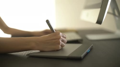 Hand Using Graphics Tablet for Digital Art