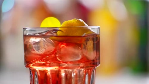 Glass of Negroni Quickly Rotates
