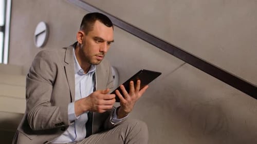 Businessman with Tablet Pc at Office Stairs 36