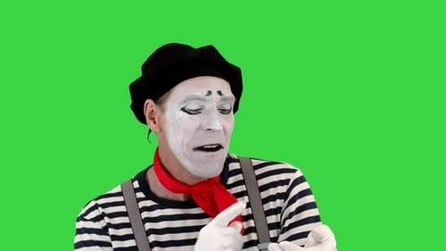 Lustiger Mime mit imaginärem Smartphone auf einem Greenscreen-Chroma-Key