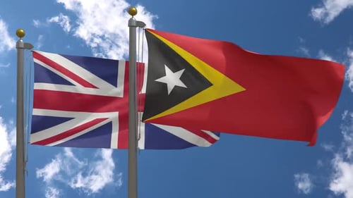 Flagge des Vereinigten Königreichs gegen Osttimor-Flagge am Fahnenmast