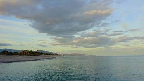 Sandy Coast near the Calm Ocean