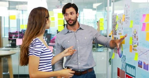 Colleagues Collaborate on Project in a Modern Office