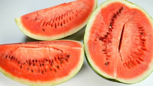 Fresh Watermelon Slices and Halved Fruit