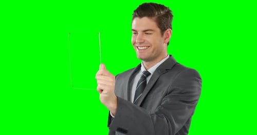 Man Uses Transparent Tablet on Green Screen