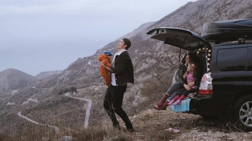 Family Enjoys Mountain View on Road Trip