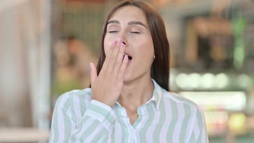 Young Woman Yawning in Close Up Shot