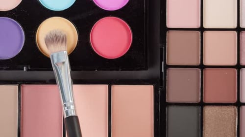 Makeup Brush Touches Colorful Face Powder Palette