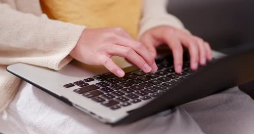 Woman working on laptop computer