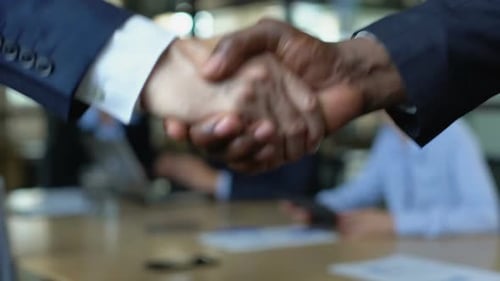 Business Handshake Close Up in Corporate Workplace