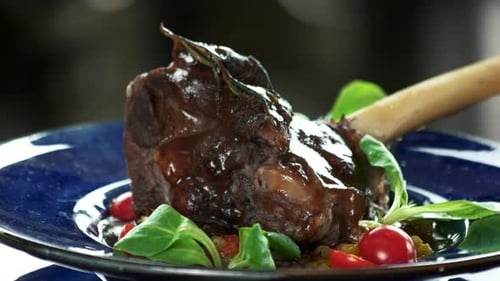 Braised Lamb Shank with Vegetables on Plate
