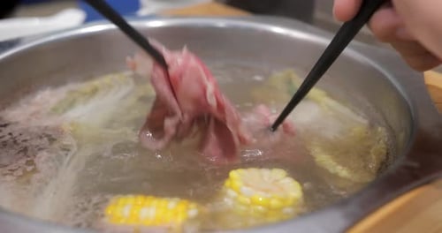 Having hotpot at restaurant