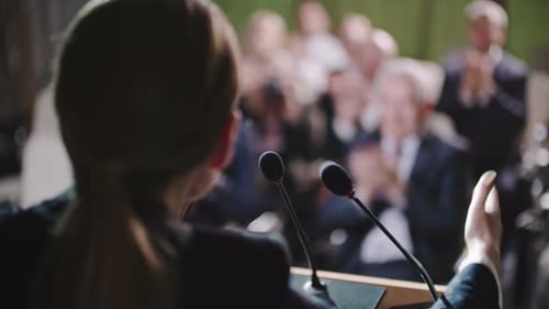 Speaker Addresses Audience at Business Conference