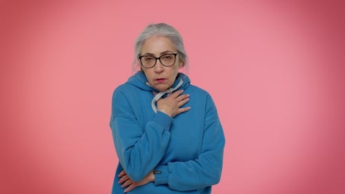 Senior Woman Coughing Holding Sore Throat