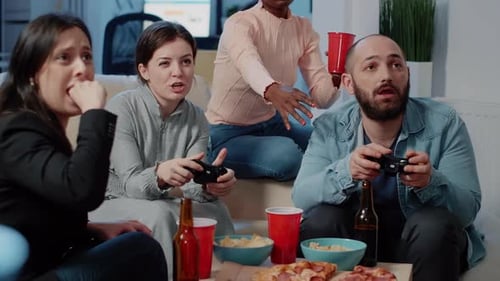 Close Up of Colleagues Playing Video Games on Console