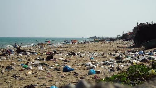 Plastic Garbage Scattered On The Seashore Of Beach In Phan Ri Cua, Vietnam. - wide