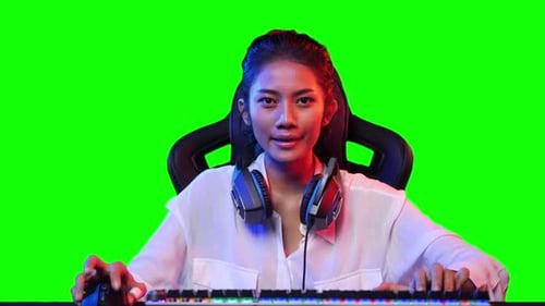 Woman playing game with green screen