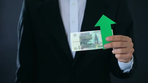 Financial Expert Holding Russian Ruble Banknotes Showing Thumbs Down, Growth