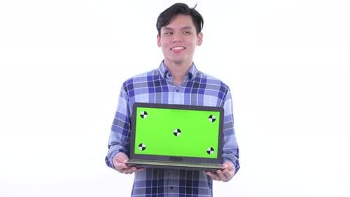 Man Holds Laptop with Green Screen for Chroma Key