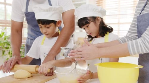 Happy Family Baking Together in the Kitchen