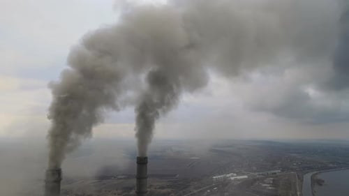 Aerial View of Coal Power Plant High Pipes with Black Smoke Moving Up Polluting Atmosphere