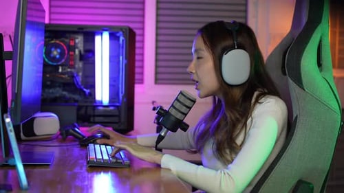 Young Woman Gaming and Streaming in Neon Lit Room