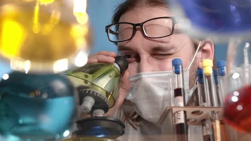 Close-up of Scientist Using Microscope in a Lab
