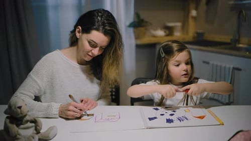 Mother and Child Drawing Together at Home