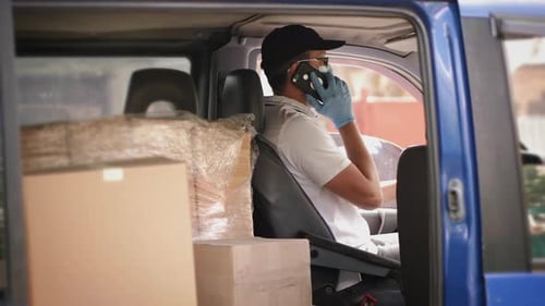 Masked Man in Delivery Van Makes a Call
