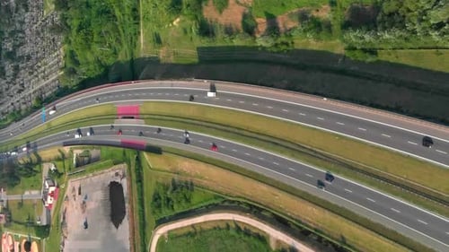 Aerial View Of A Freeway. Descending Shot Cars Driving By the Road. Traffic on the Highway. Footage