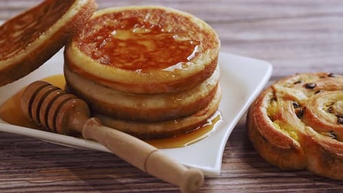 Pancakes with Syrup and Pastry Close Up