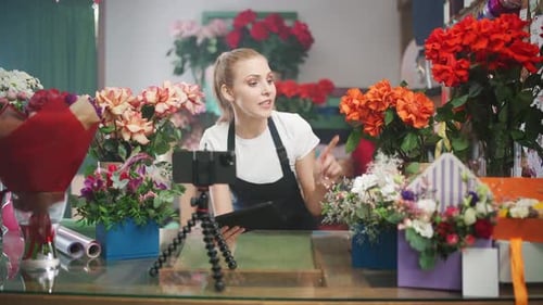 Woman Vlogging in Colorful Flower Shop