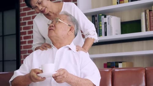 Senior Man Gets a Massage and Tea at Home
