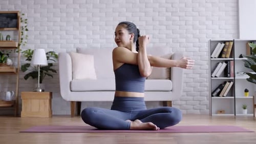 Asian woman pilates exercise yoga at home.