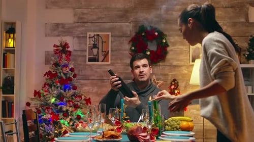 Family Celebrates Christmas Holiday at Home Dinner