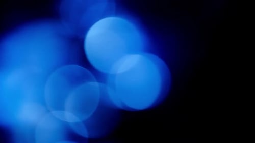Abstract Blue Bokeh Lights on Black Background