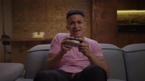 Young Adult Expresses Frustration Losing Video Game